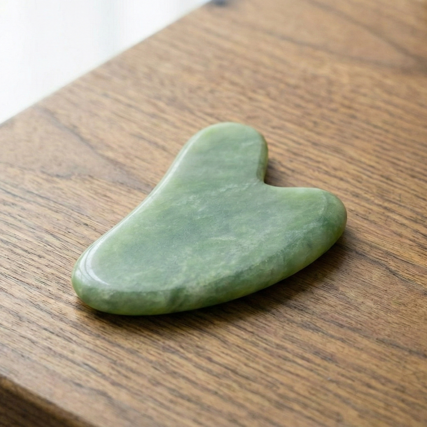 A jade gua sha tool.
